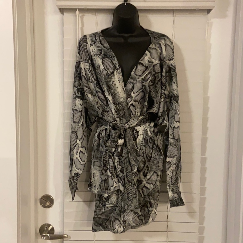 Snakeskin wrap blouse. Smoke free and pet free home. Brand new with tags.